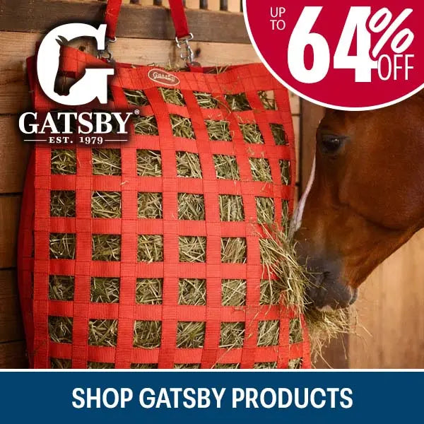 A red Gatsby brand hay net hanging on a wooden stable door, with a brown horse eating hay through the mesh. Prominent text includes up to 64% off shop gatsby products
